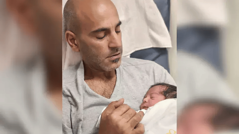 Itai and his newborn son Bar Shavit