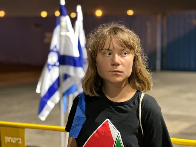 Greta at Ashdod port in front of an Israeli flag