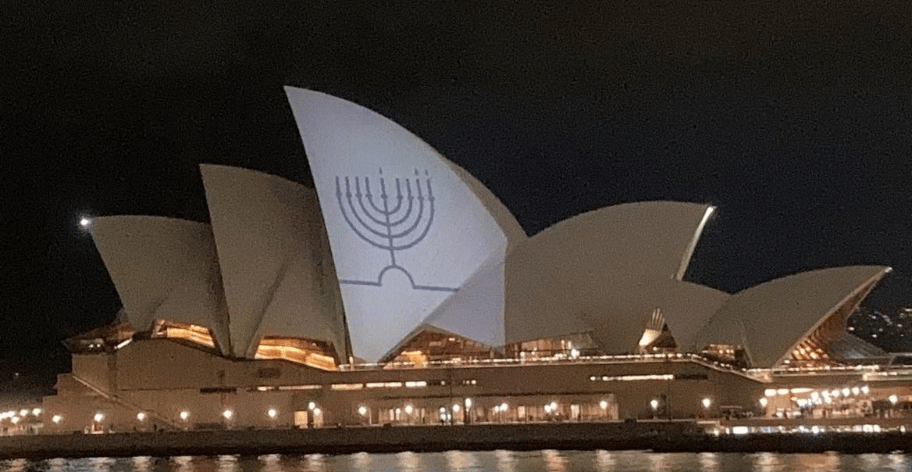 A chanukia lit up on the side of the Sydney Opera House.