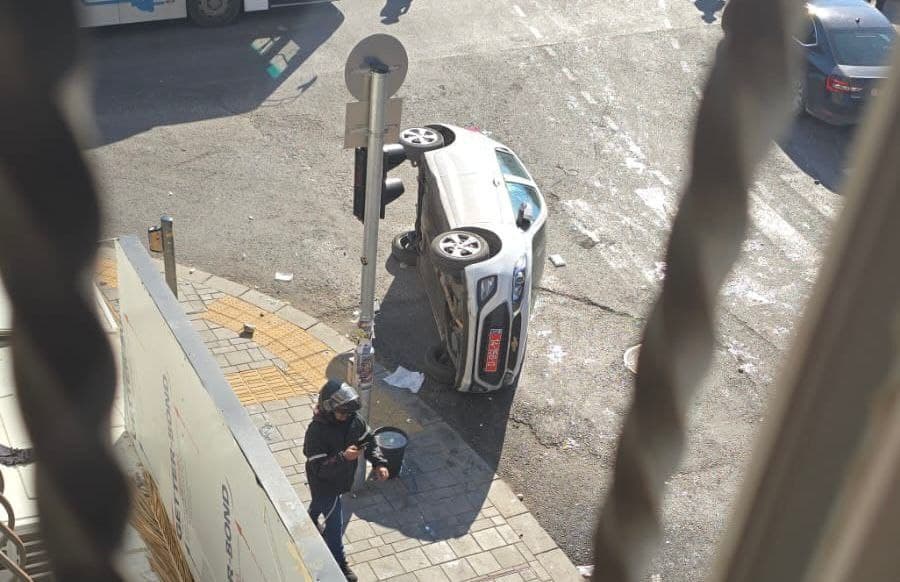 A police car flipped over.