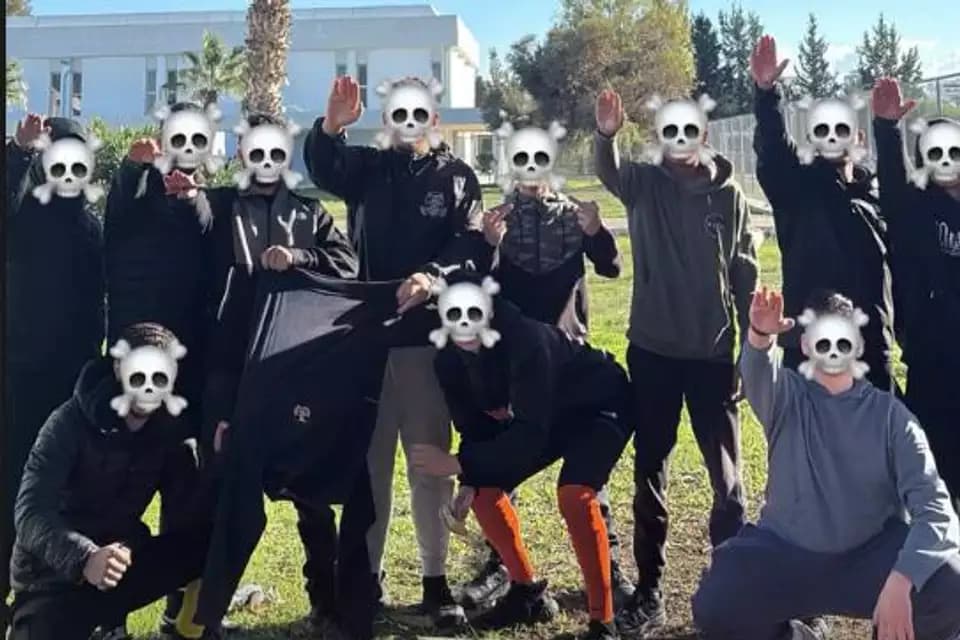 The students photographing themselves giving Nazi salutes.