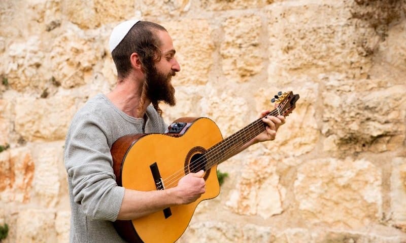 Shmuel with his guitar.