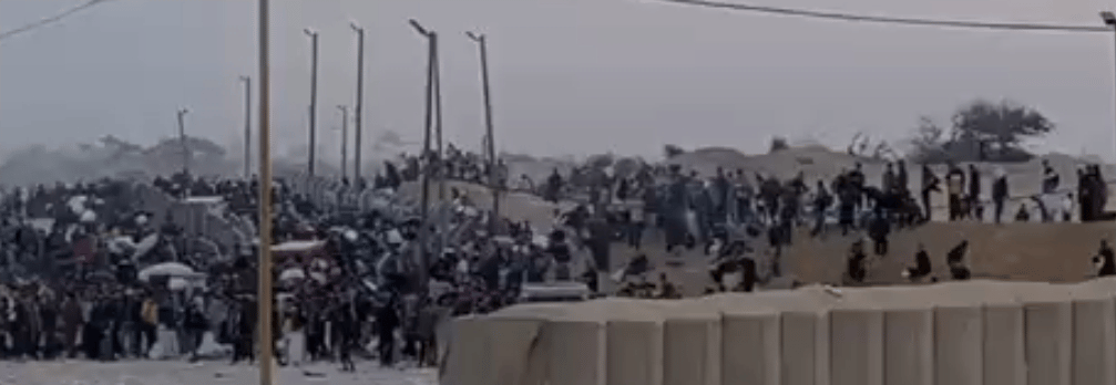 Gazans gathering aid at site peacefully.