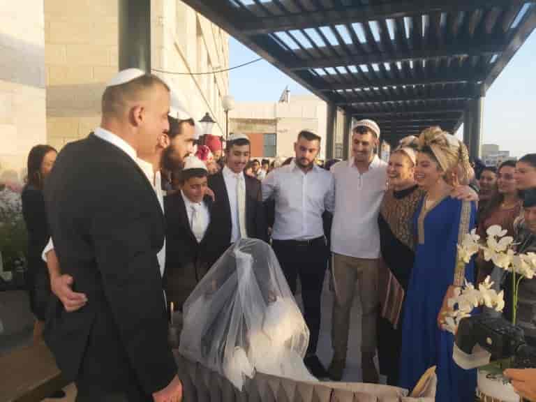 Ronit and her family at her daughter's wedding background