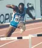 Edwin Moses during a race background
