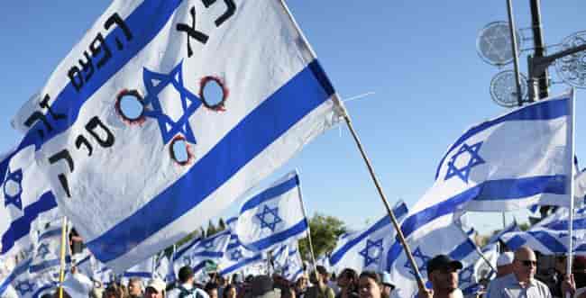 A demonstration in front of the Knesset background