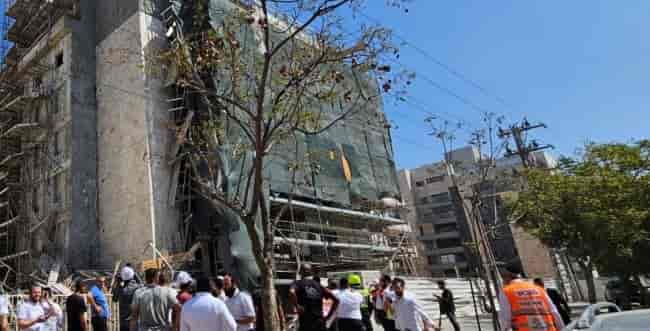 Scaffolding collapsed at a construction site in Ashdod background