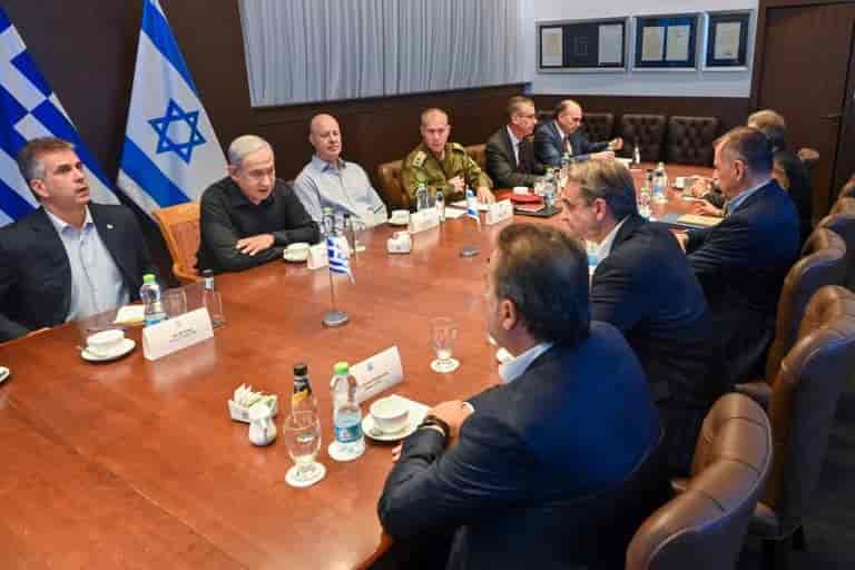 Netanyahu with his Greek counterpart. background