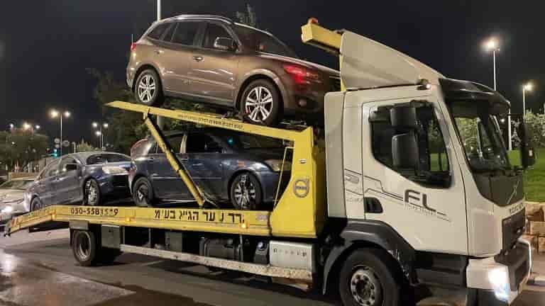 The vehicles found in the prisoners' homes background