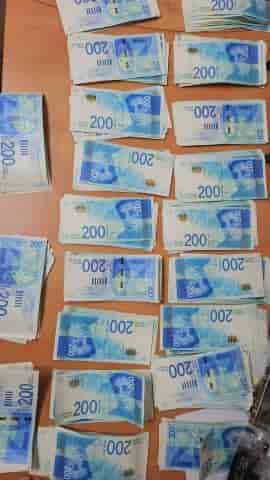 The money found in the prisoners' homes background