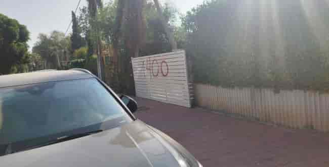 Graffiti spraypainted near MK's home. background