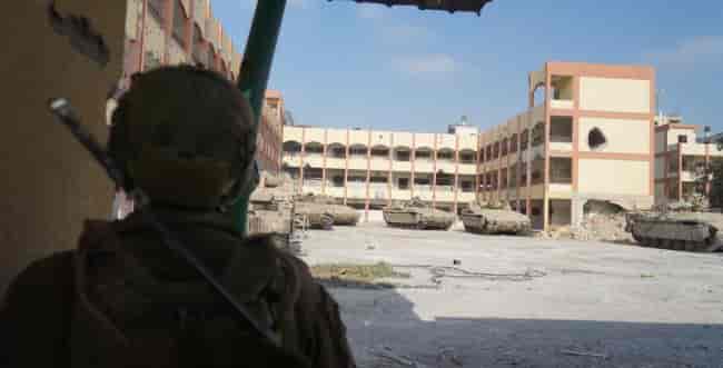 IDF forces active in the center of Gaza City. background