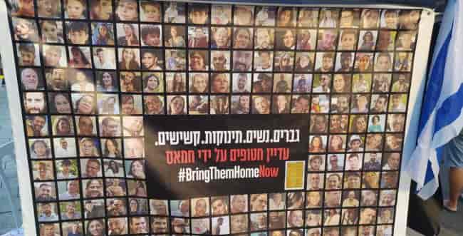 A display for the return of the abducted in front of the Kirya background