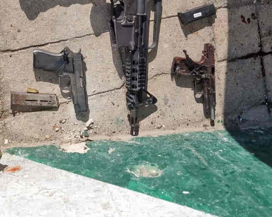 The weapons seized at the scene background