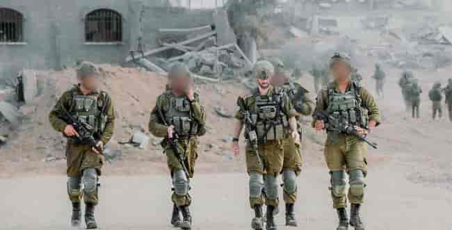 Fighters of the battalion in the Gaza Strip background