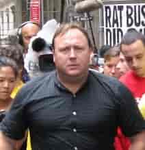 Reinstated to X/Twitter by public demand. Alex Jones at 9/11 Truther Event. background