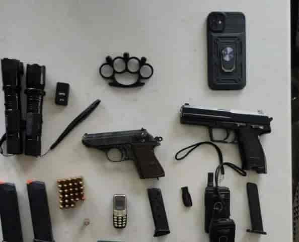 The weapons seized at the scene background