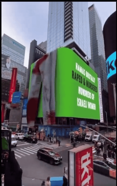 "Hamas Brutally Raped and Murdered Hundreds of Israeli Women." Ad on Hamas atrocities in Times Square. background