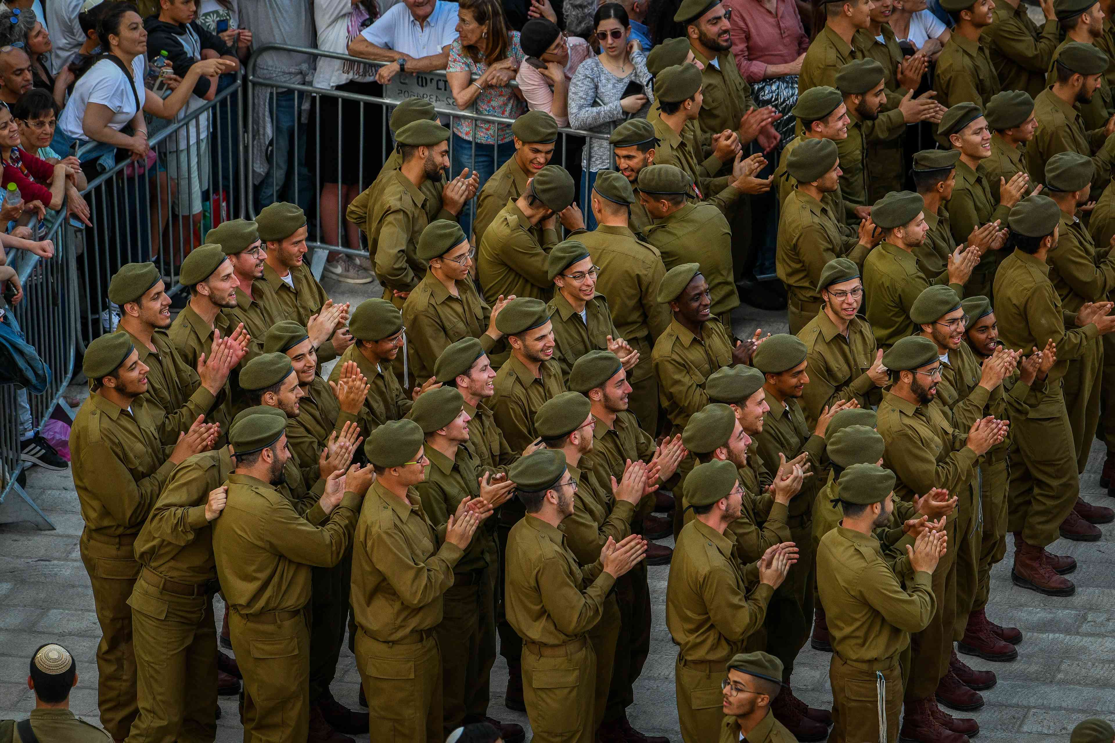The desire to enlist as an opportunity. Charedi Netzach Yehudah Battalion soldiers at Western Wall. background