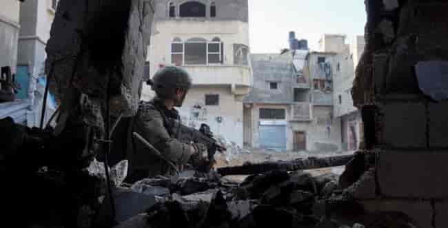 IDF soldier in Gaza background