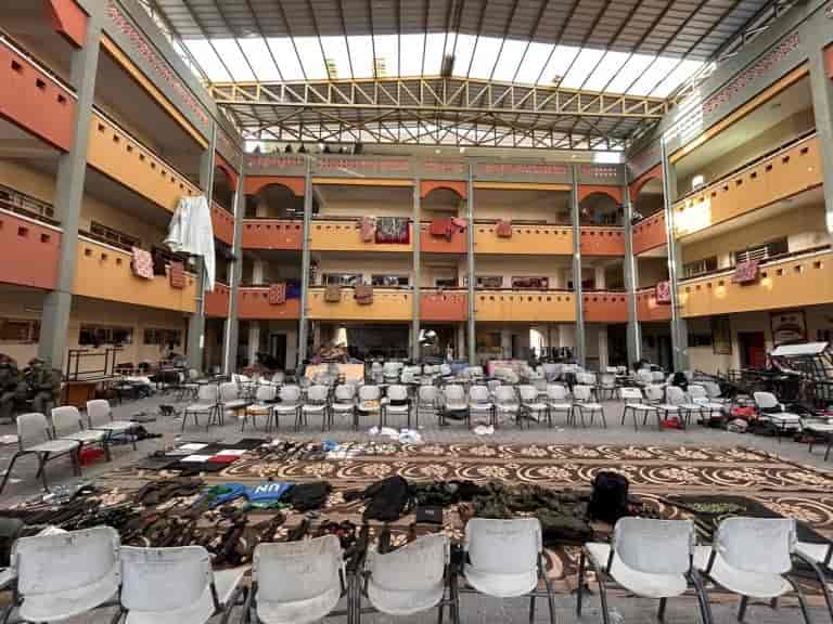 Weapons in a school in Gaza background