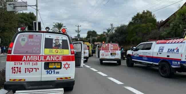 ZAKA, MDA, and Police forces at the scene background