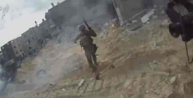IDF soldiers in Gaza background