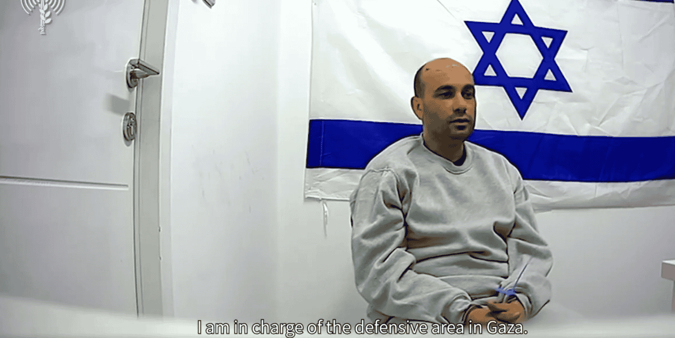 Terrorist commander discussing his role at Shifa Hospital. background