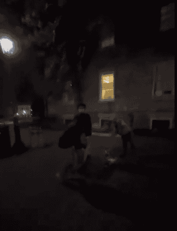 Students removing hostage names written on the ground. background
