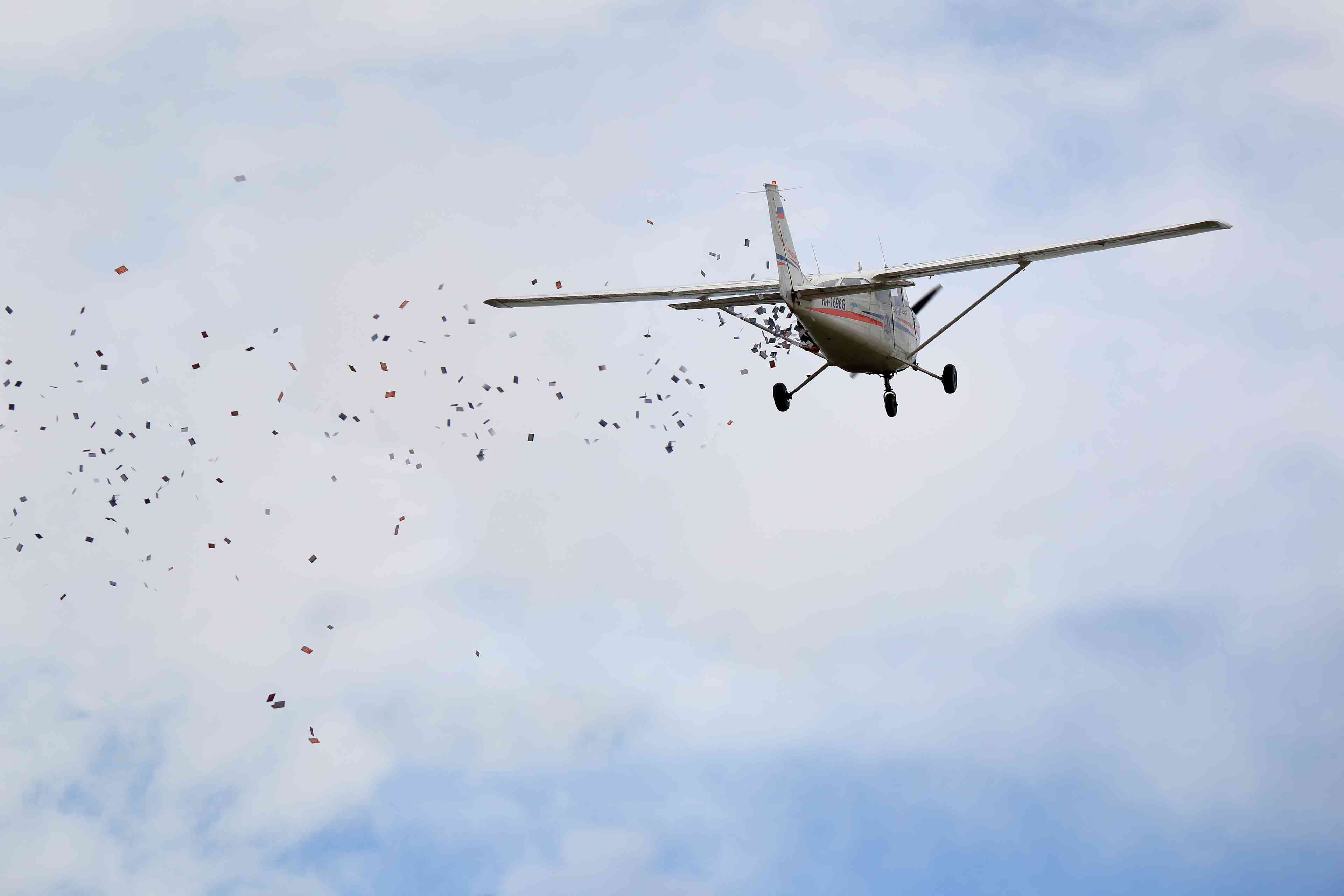 Plane dropping leaflets (Illustration) background