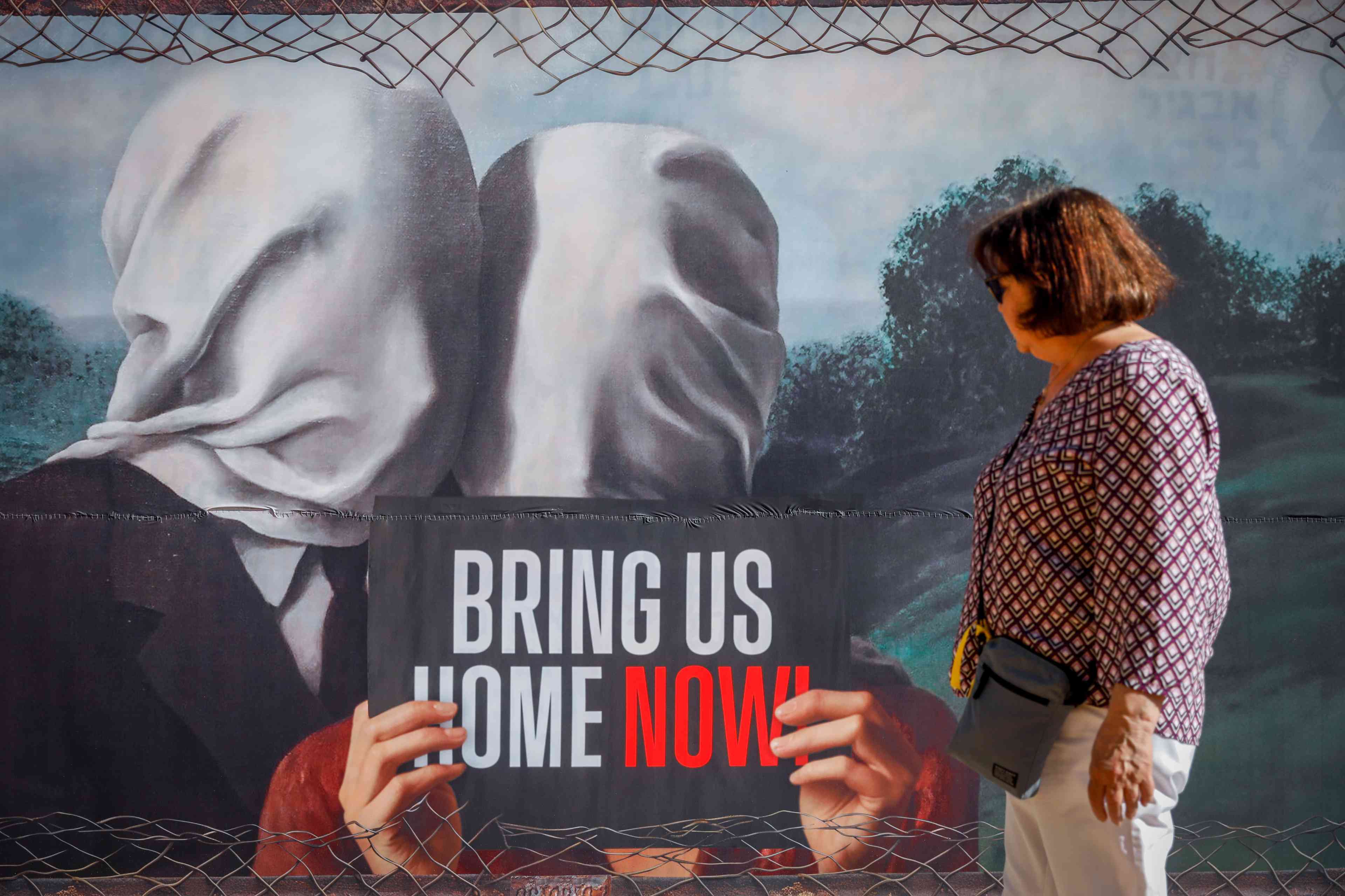 People walk at "Hostage Square" in Tel Aviv, May 7, 2024. background