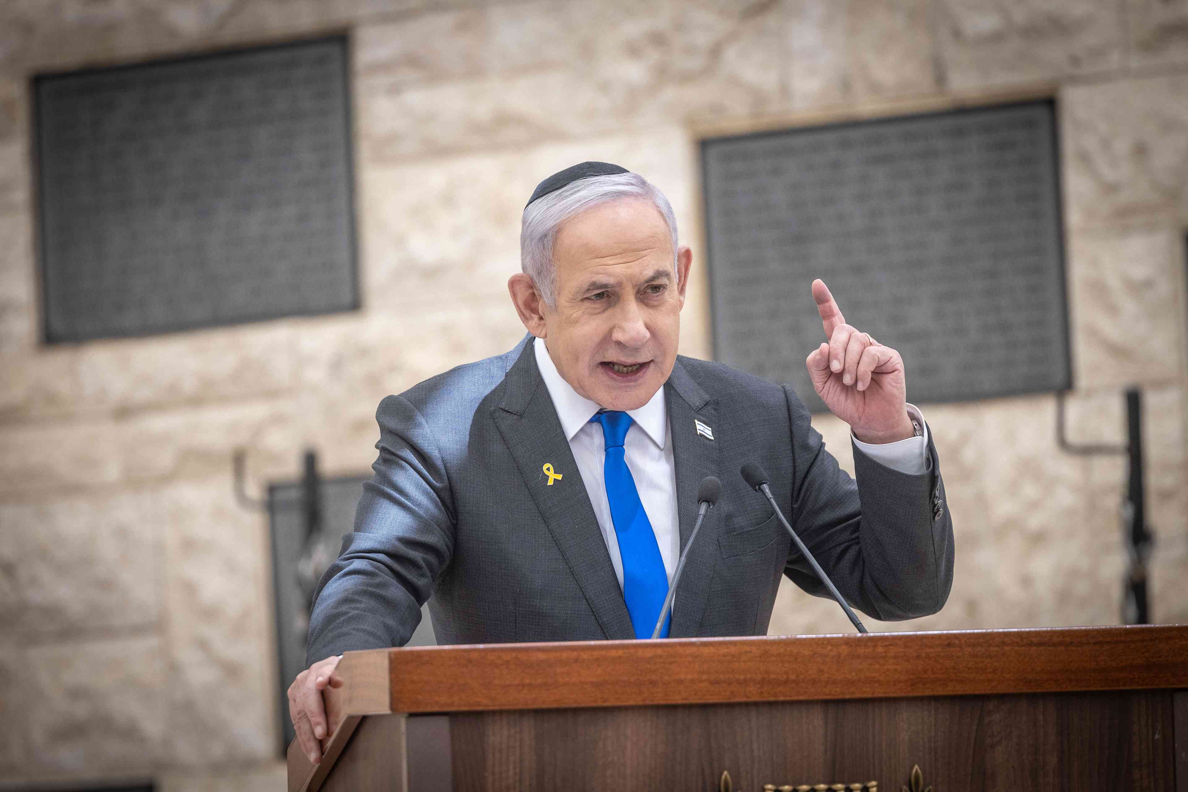 Israeli Prime Minister Binyamin Netanyahu attends a state memorial ceremony for victims of terror, at Mount Herzl military cemetery in Jerusalem, May 13, 2024, during Memorial Day which commemorates the fallen Israeli soldiers and victims of terror. background