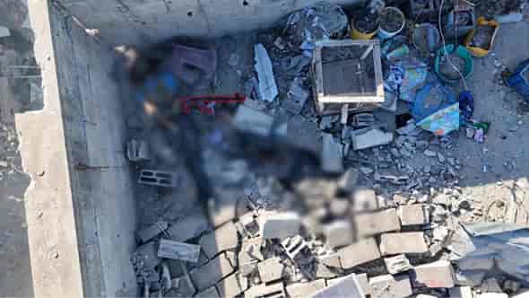 Terrorist killed by IDF forces after firing on them from rooftops. background