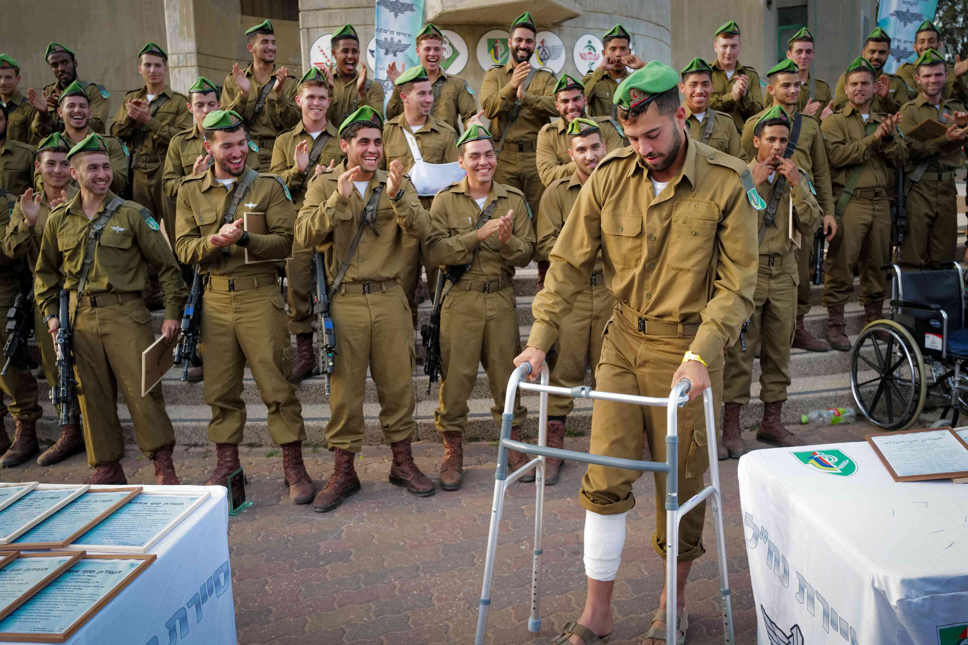 Wounded IDF soldier participating in his training graduation ceremony background