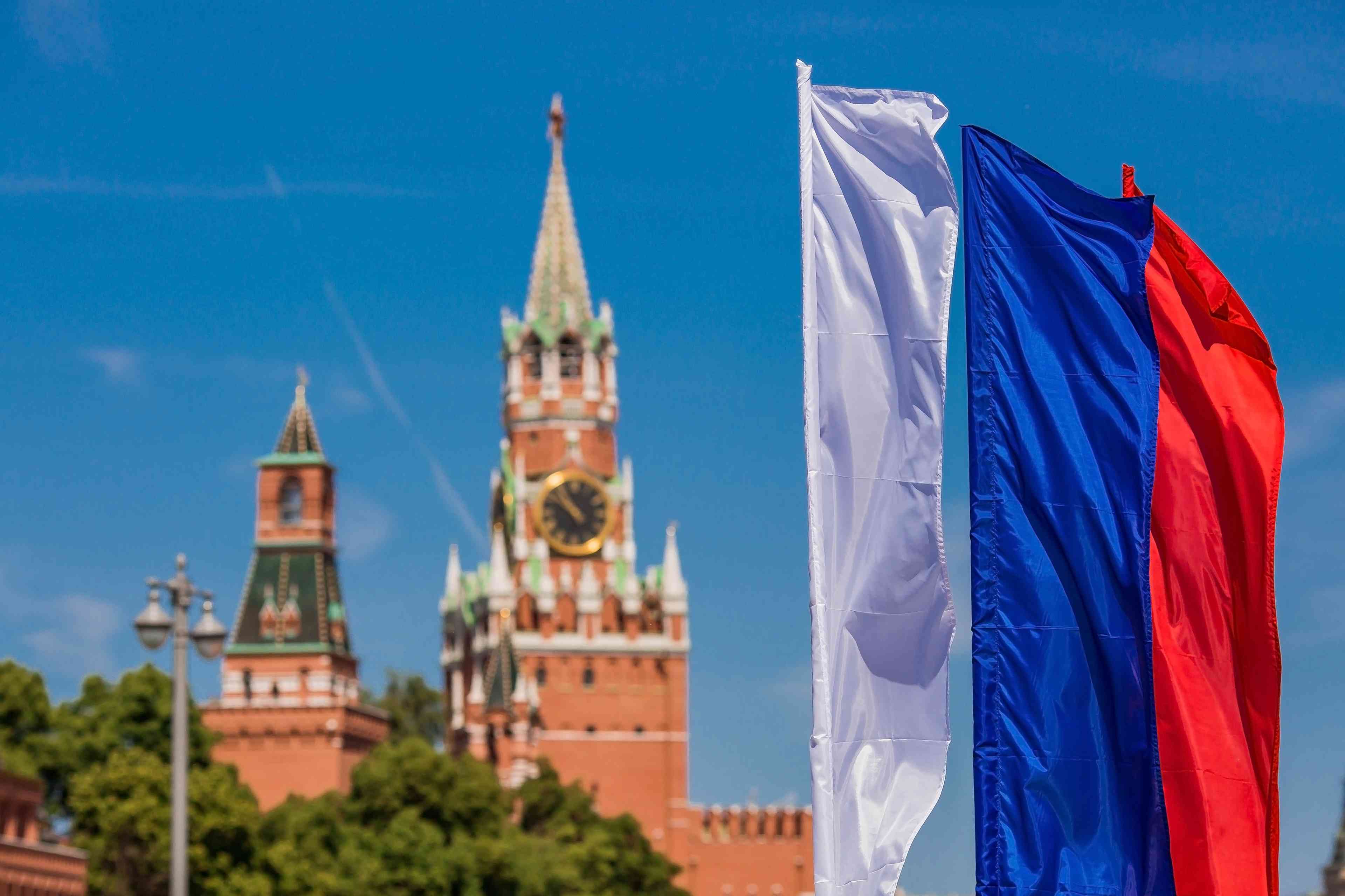 Russian Flag in front of Kremlin background
