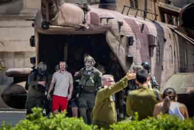 Released hostages Andrey Kozlov and Almog Meir arrive at the Sheba Medical Center, June 8, 2024. background