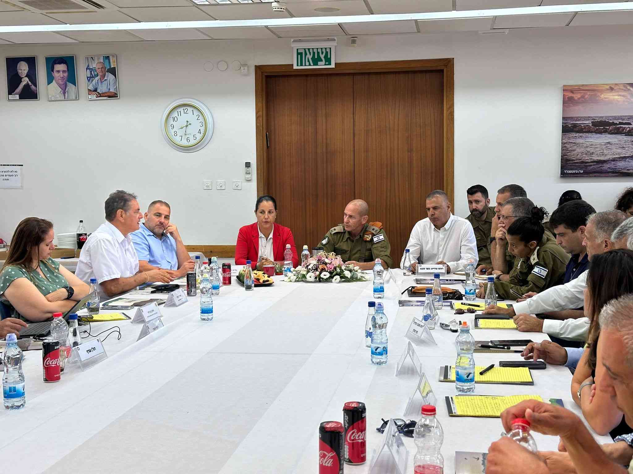 IDF Rear Command commander Maj.-Gen. Rafi Milo meets with local leaders. background