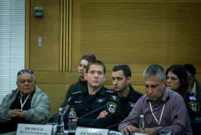 Moti Shif (C) from Lahav 433 attends a special committee for public inquiries in Jerusalem. February 14, 2024.  background