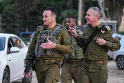 IDF Chief of Staff Herzi Halevi and IDF Spokesperson Daniel Hagari arrive at an army base in southern Israel, December 26, 2023. background