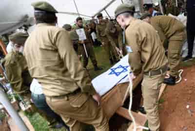 Israeli soldiers carry the coffin of fallen IDF soldier, Kfar-Sava, Israel. background