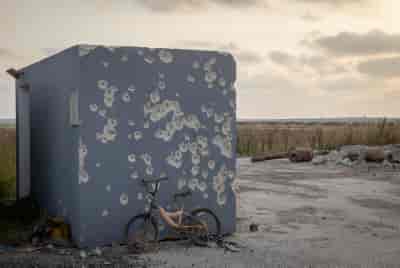 The damage caused to a public bomb shelter at the October 7 massacre, southern Israel, April 30, 2024. background
