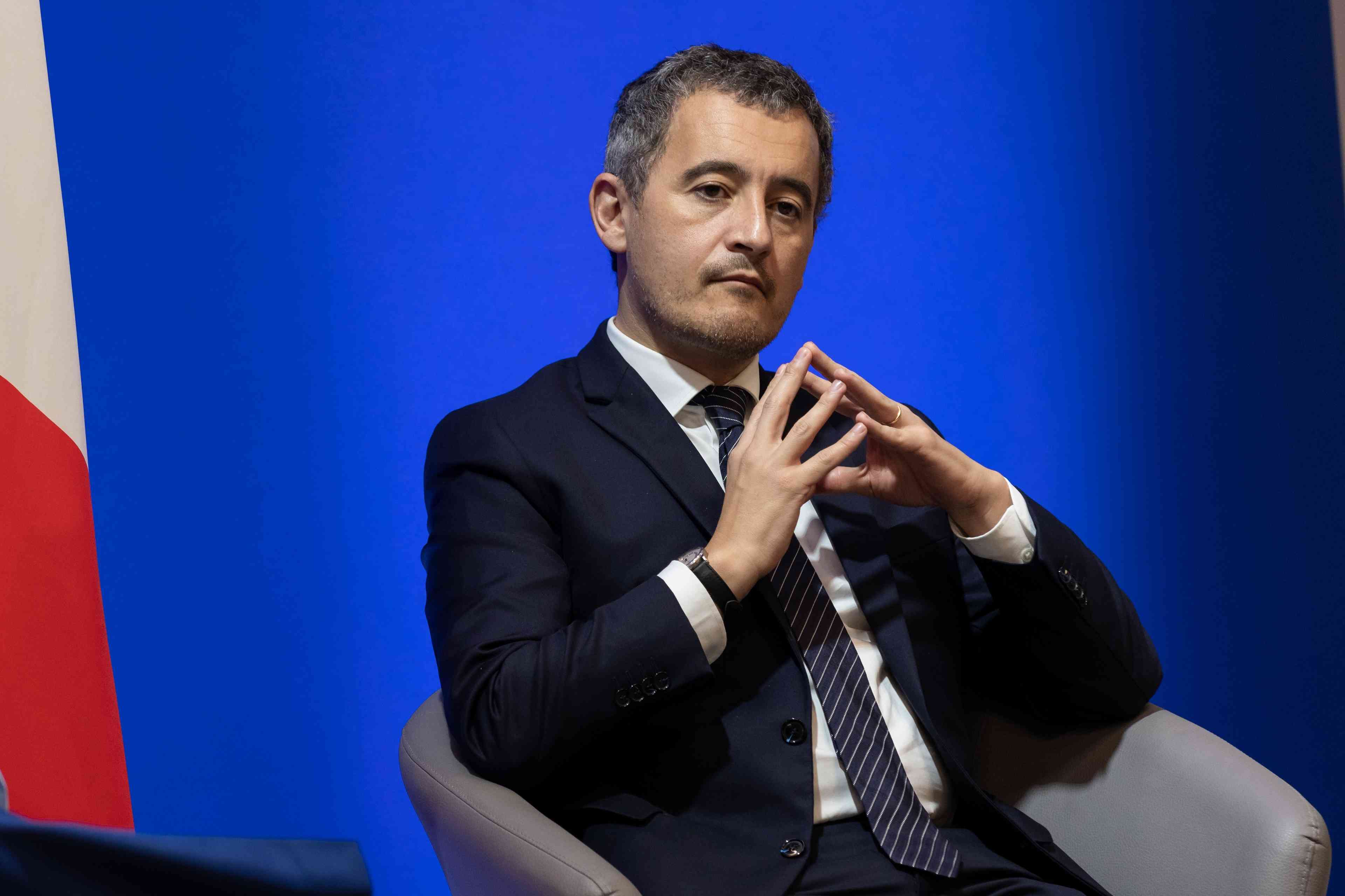 French Interior Minister Gérald Darmanin. background