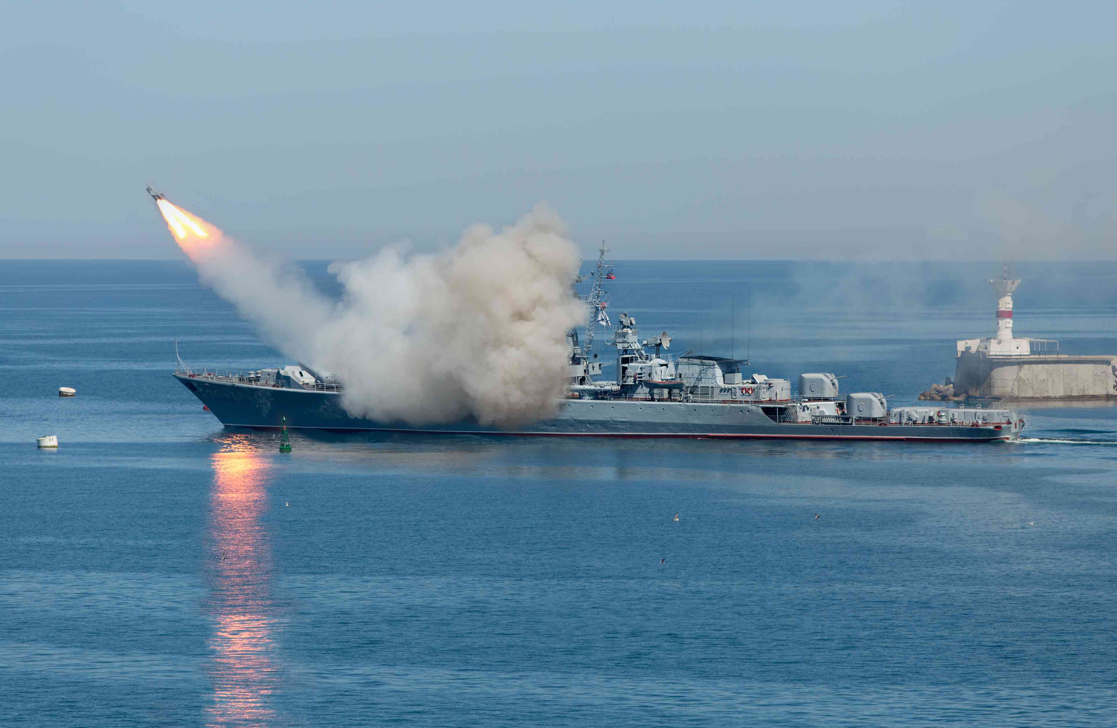 Rocket launch from warship background