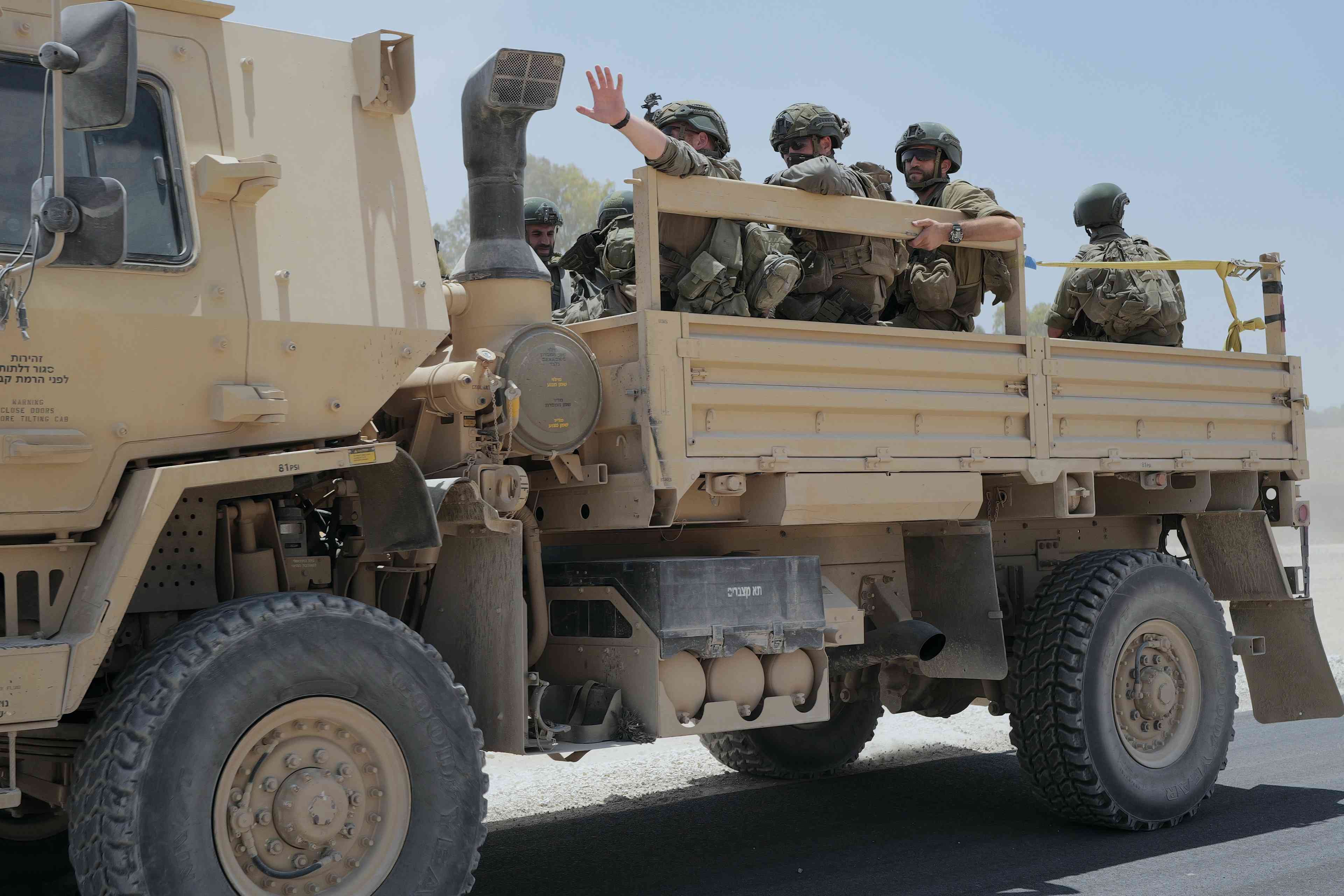 IDF troops in Gaza background
