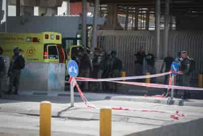 Israeli security forces guard at the Qalandiya Checkpoint near Ramallah. background