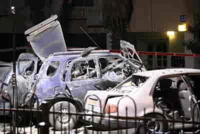 Israeli bomb squad police unit investigate a car which was bombed. background
