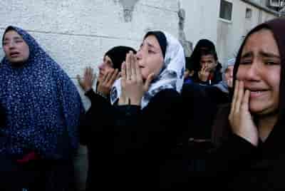 Palestinians in Khan Younis in the southern Gaza Strip background