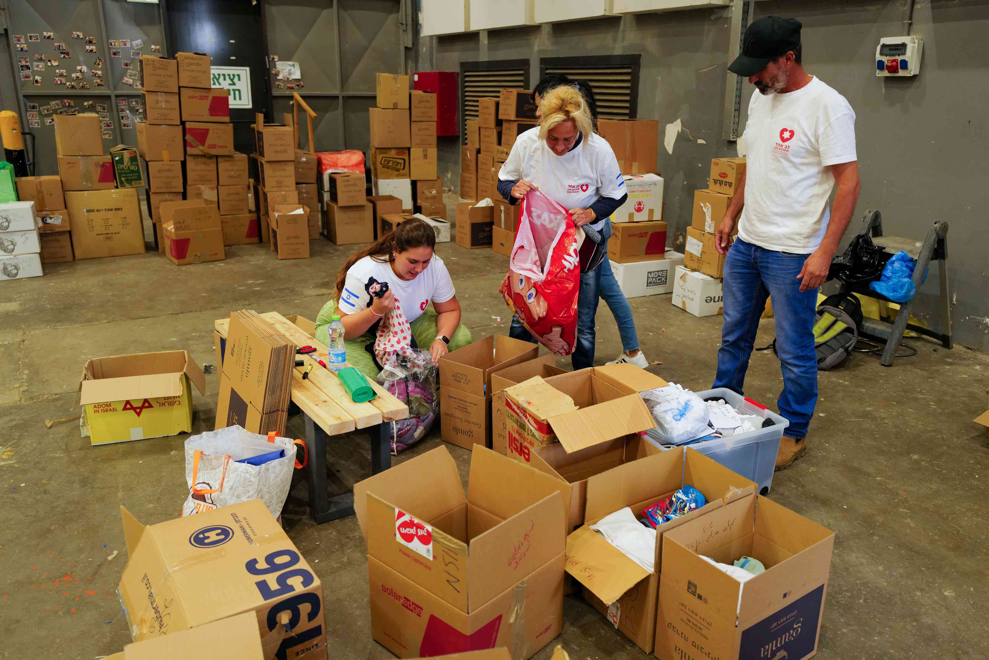 Organisation sorting through donations for evacuees background