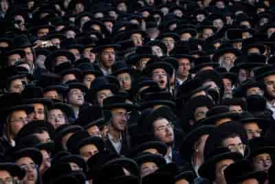 Thousands of ultra-Orthodox jews attend a rally against the recruitment of Ultra Orthodox Jews to the IDF, Jerusalem, June 30, 2024. background