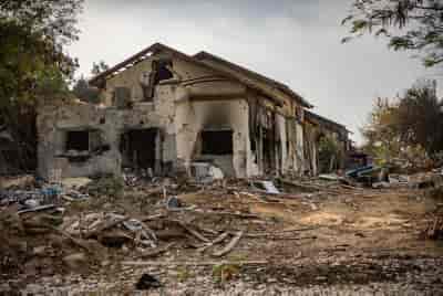 The remains of the destruction caused by Hamas terrorists when they infiltrated Kibbutz Be'eri on October 7 background